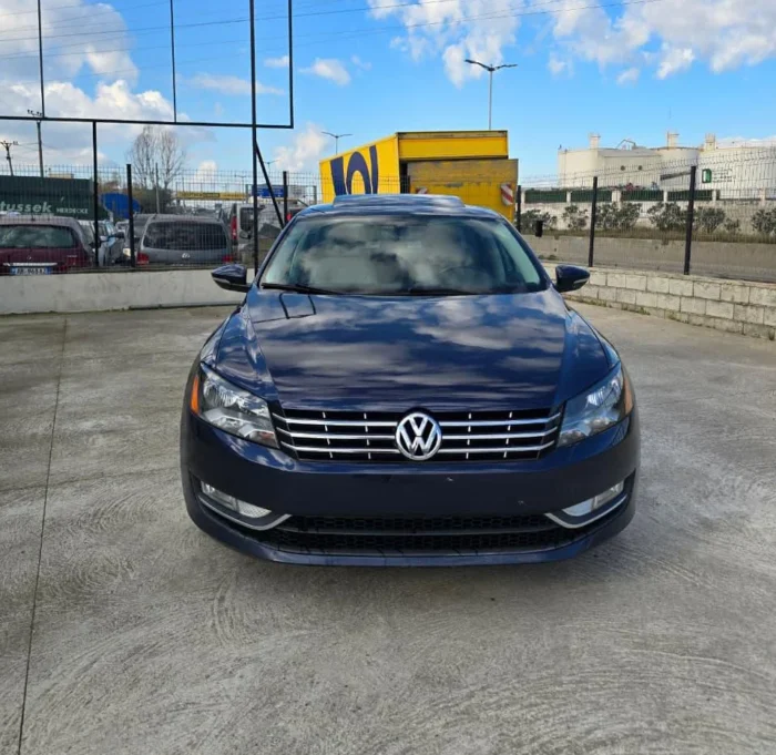 Front view of dark blue VW Passat SEL 2013 2.0 TDI diesel automatic rental car on a sunny day in Albania