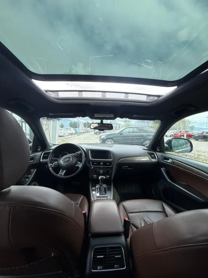 Black Audi Q5 2015 3.0 TDI diesel automatic premium SUV with panoramic sunroof and leather interior available for family car rental at Tirana Airport Albania