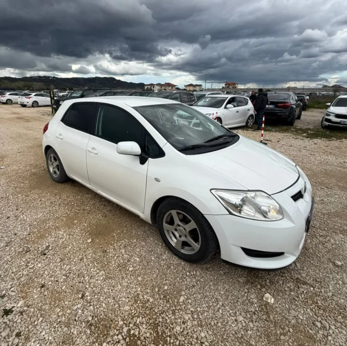 White Toyota Auris 2010 1.4 diesel manual hatchback rental car available from TiRental in Albania