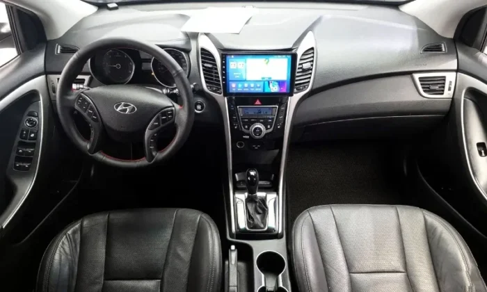 White Hyundai i30 2013 1.6 diesel automatic five‑door hatchback with alloy wheels, available for car rental in Tirana Albania from TiRental
