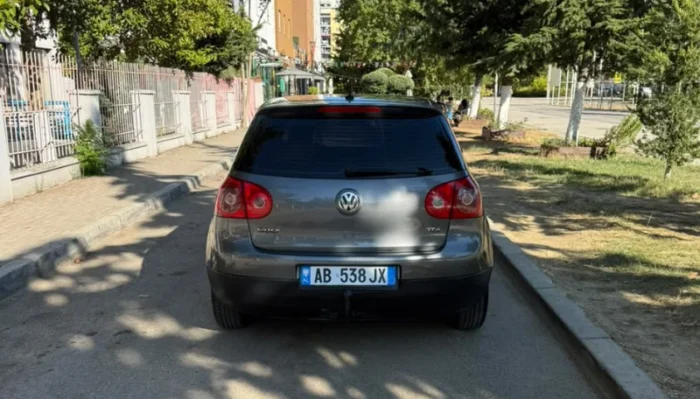 Grey Volkswagen Golf V 2007 1.9 TDI automatic diesel five‑door hatchback parked in Tirana, available for car rental in Albania with TiRental