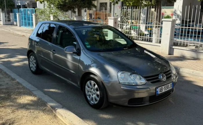 Grey Volkswagen Golf V 2007 1.9 TDI automatic diesel five‑door hatchback parked in Tirana, available for car rental in Albania with TiRental