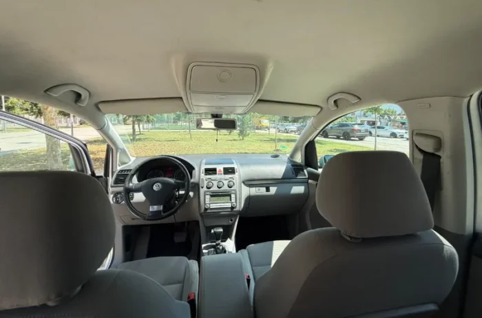 Silver Volkswagen Touran 2.0 TDI automatic 2008 seven‑seater MPV parked in Tirana, available for family van rental in Albania with TiRental