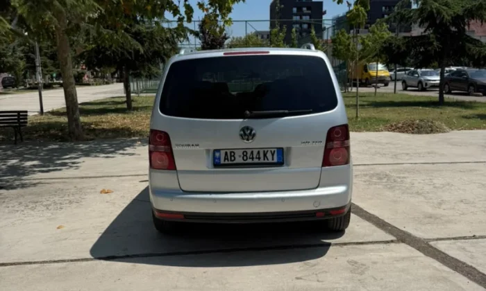 Silver Volkswagen Touran 2.0 TDI automatic 2008 seven‑seater MPV parked in Tirana, available for family van rental in Albania with TiRental